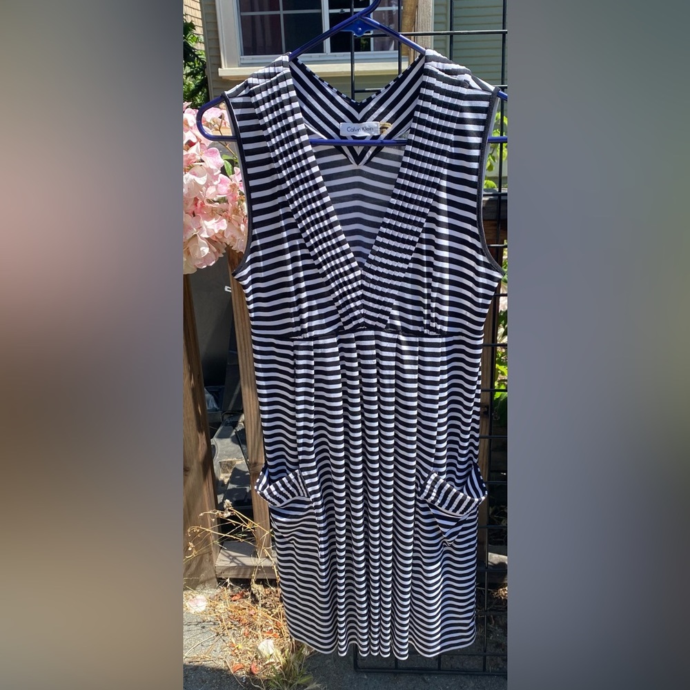 Black and white striped sleeveless Calvin Klein dress with pockets.